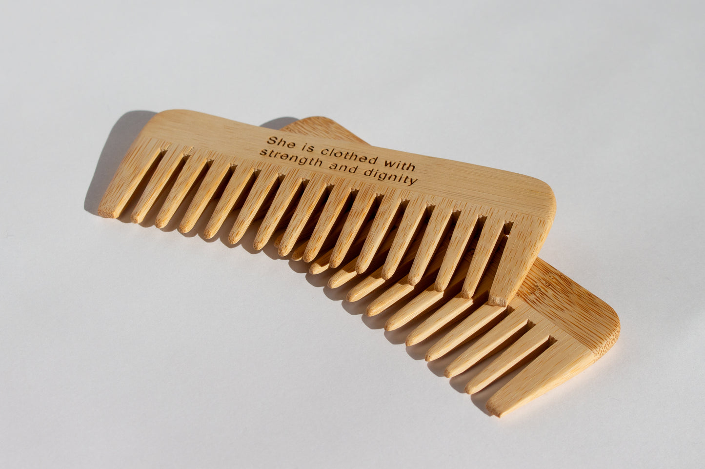 Birth comb size shown in the palm of a hand
