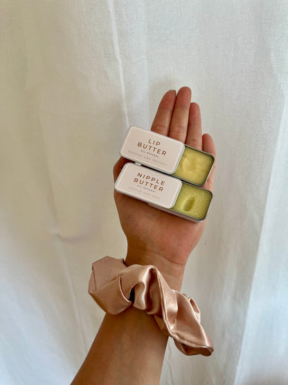 Natural lip butter tin held in hand