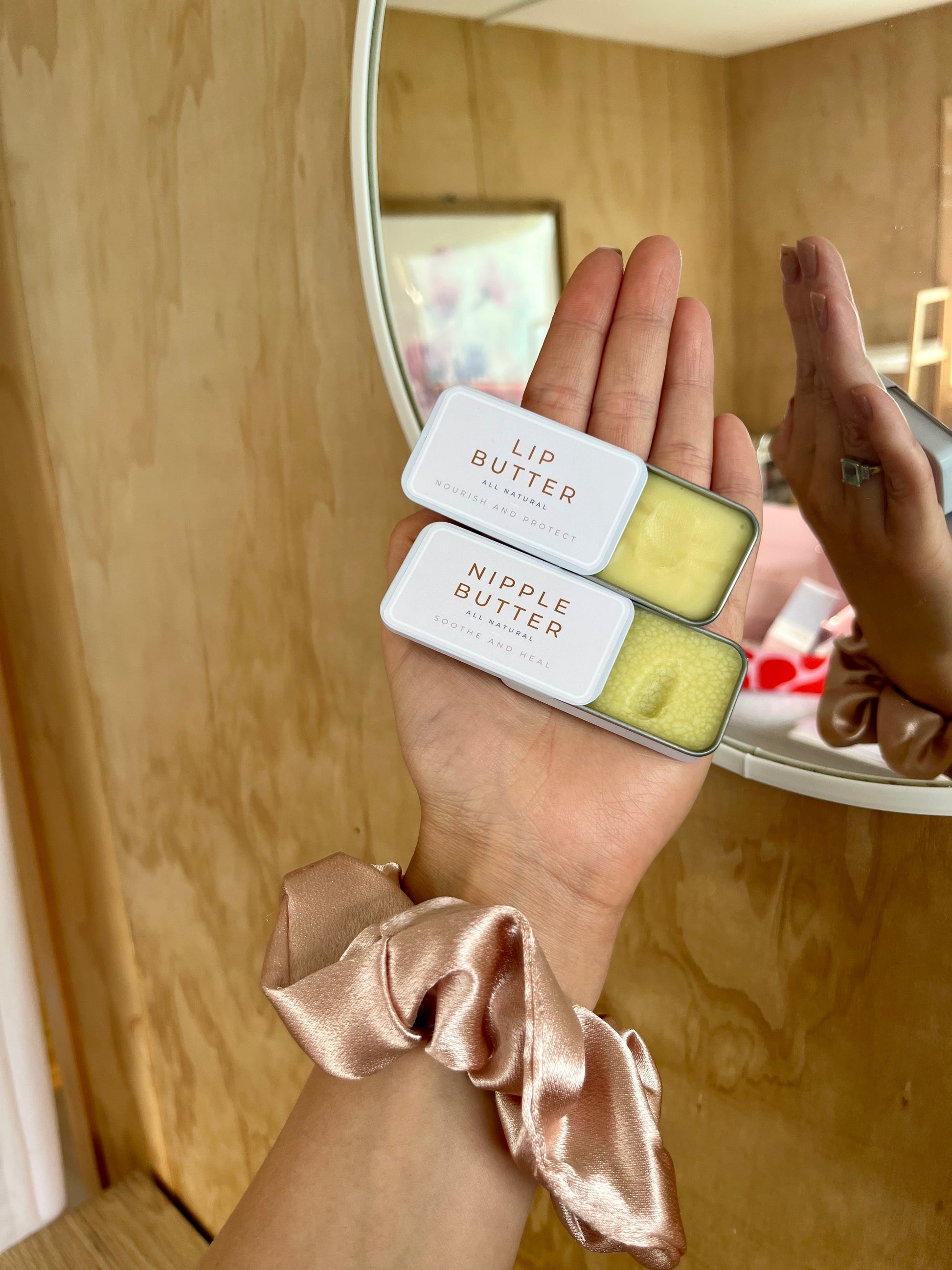 Nipple butter tin showing natural ingredients label